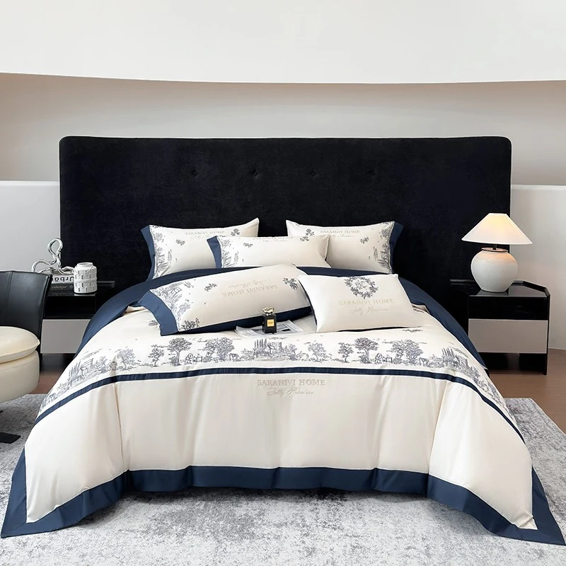 Ivory four-piece bedding with sapphire-blue borders and scenic embroidery