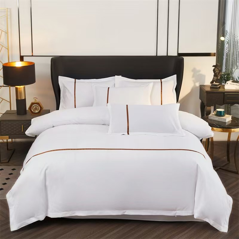 White bedding set arranged for hotel supply